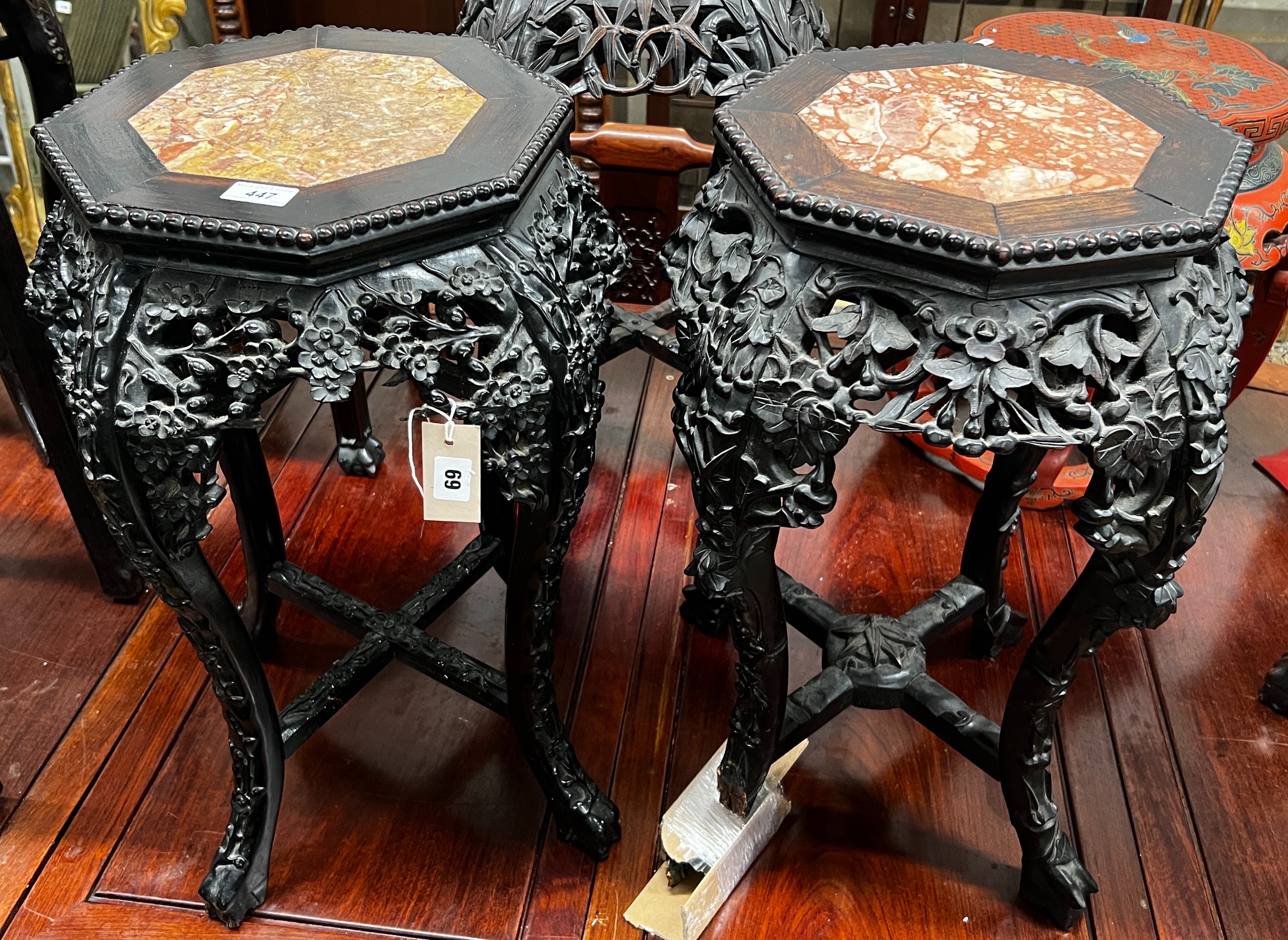 A near pair of Chinese marble top octagonal carved hongmu vase stands, width 40cm, height 62cm